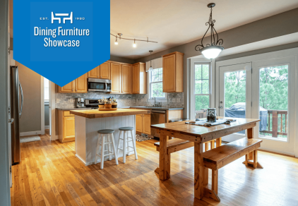 Eat-in kitchen featuring an island with two stools and a dining table with bench seating.