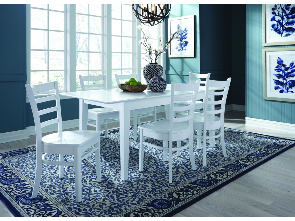 white dining table with multi coloured chairs